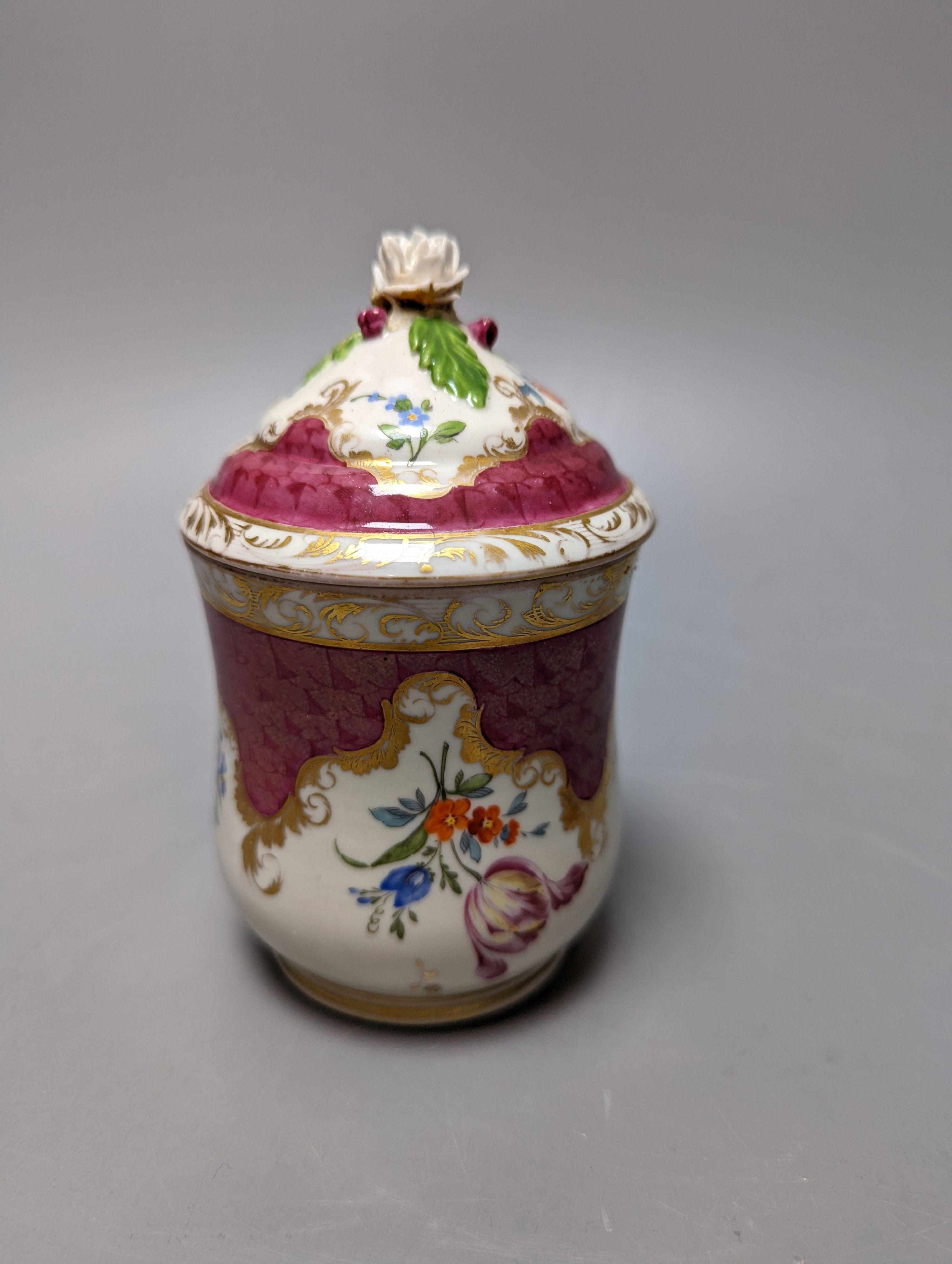 A Meissen style chocolate cup and cover, two mid 19th century English porcelain flower encrusted pots and covers and two dishes